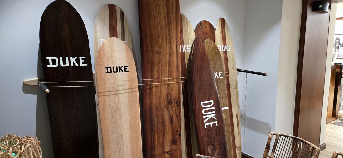 Dark and light wooden boards side by side, each marked DUKE.